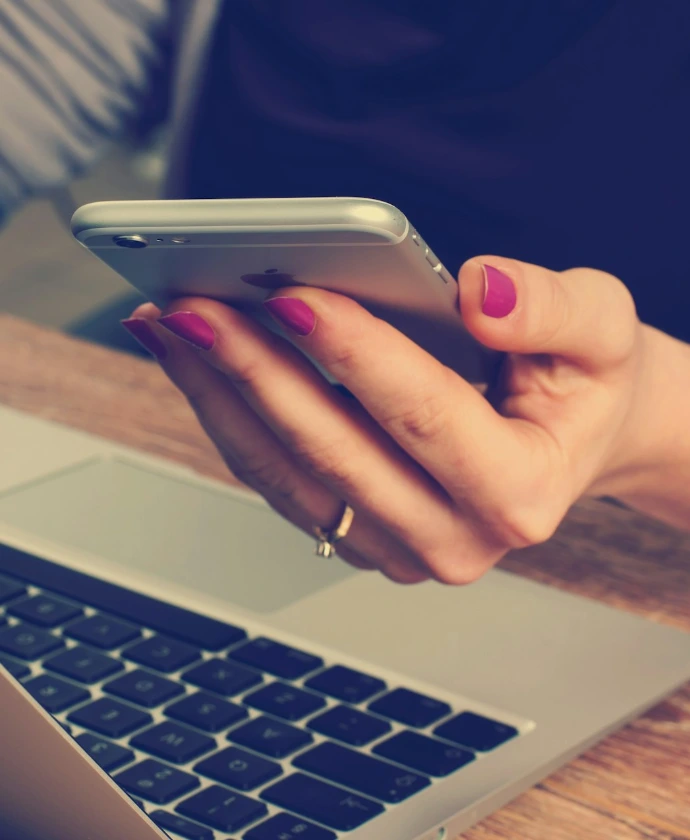 woman holding silver iPhone 6